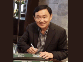 File photo of Thaksin Shinawatra sitting in a chair, used for coverage of his royal defamation trial in July 2025